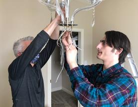 Lanning and Gary Taking down restoring putting up hanging restoring repairing of chandelier