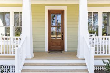 Bright front door renovation by Creative Associates in Willow Springs