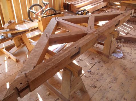 Kingpost truss, rough-sawn black cherry timbers.