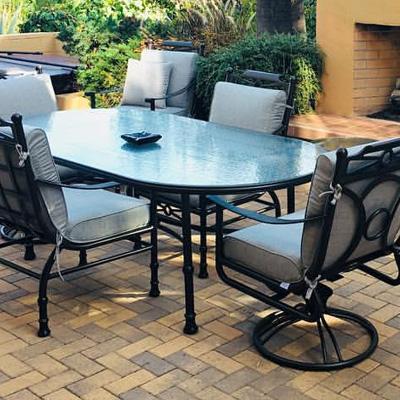 Mallin arlington patio dining chairs with grey sunbrella backyard cushions