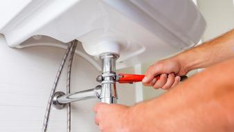 handyman fixing sink