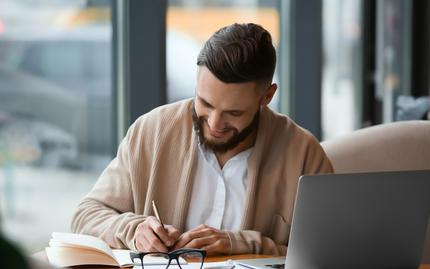 Image of a man working at a desk