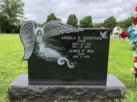 Angel shaped cemetery headstone