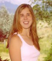 Jordan's senior picture, outdoors, smiling at camera
