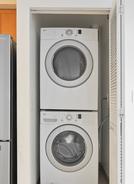 stacked washer and dryer in closet