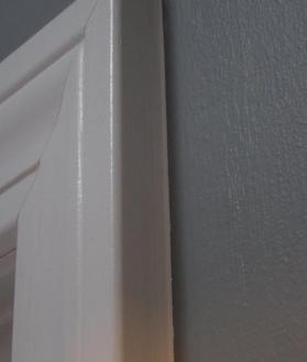 the edge of a perfectly painted door jamb. Jcb Painting.