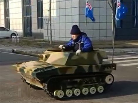 Power wheels ride store on army tank