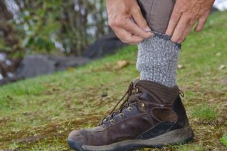 Tuck your pants into socks to prevent ticks attaching to your skin