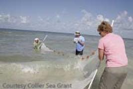 woman holding a PVC seine net pole