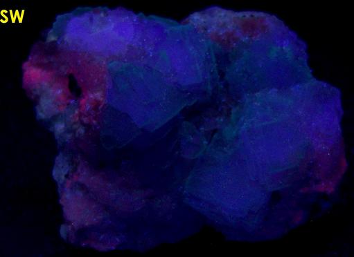 fluorescent FLUORITE on CALCITE with PYRITE, Huanzala Mine, Huallanca District, Bolognesi Province, Ancash Department, Peru