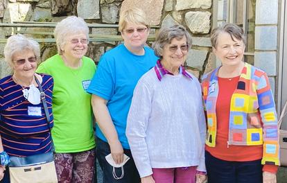 Photo of a group of FriendShip members and volunteers at an outdoor event.