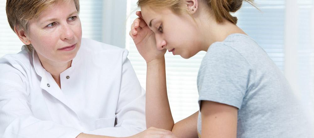 Healthcare provider assisting a patient during a consultation