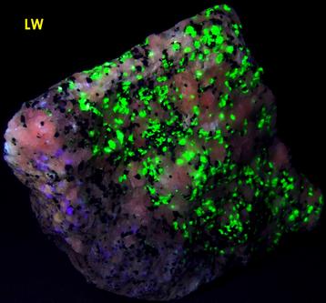 fluorescing Willemite, Hardystonite, Rhodonite, Franklinite, Calcite -Franklin Mine, Franklin, Franklin Mining District, Sussex County, New Jersey, USA