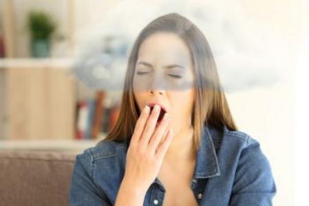 woman yawning with brain fog from Long COVID