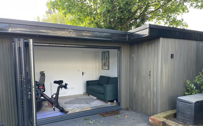 Large modern garden room with pool table and bar