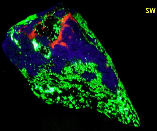 fluorescing Hardystonite, Willemite, Calcite, black Franklinite, brown Zn-Diopside Zinc Schefferite - Franklin Mine, Franklin, Franklin Mining District, Sussex County, New Jersey - type locality