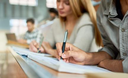 students taking notes in college class