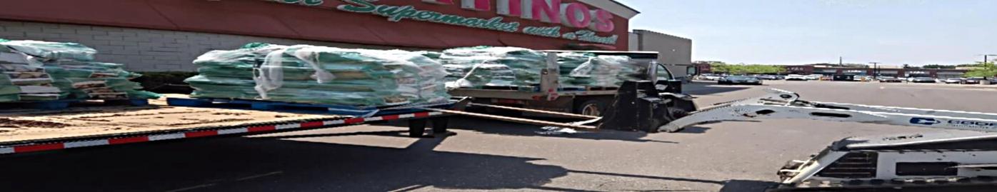 Offloading firewood bags at Fortinos with the machine