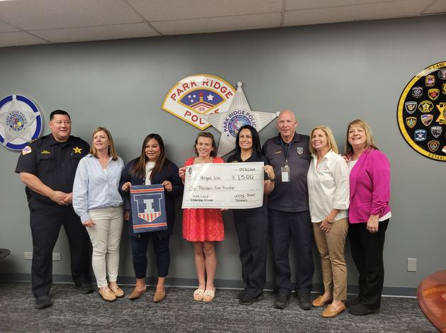 LSLE Scholarship Committee posing with check and winner, Zowie Shenberg.