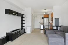 Living Room with Kitchen in background