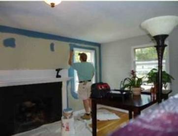 painter cutting in a wall.