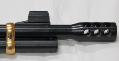 close up of lever gun muzzle with custom OHC muzzlebrake in black and original "gold" barrel band