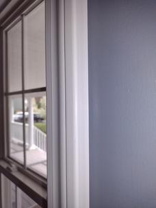 Straight edge painting window trim.