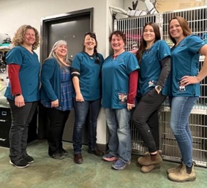 Dragon Lake Vet staff posing by front desk