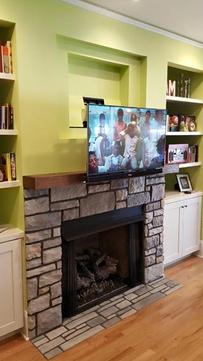 TV mounting service installation of flat screen tv that pulls down and out from over fireplace, Charlotte NC, 