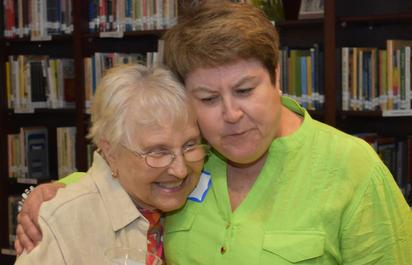 Photo of two FriendShip participants hugging.