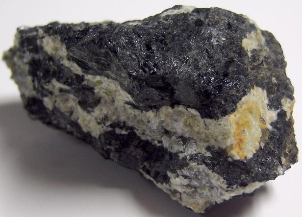 MAGNESIO-HORNBLENDE and fluorescent ALBITE, Philips Mine (Philips Pyrite Mine; Anthony's Nose Pyrrhotite Mine), Anthony's Nose, Philipstown Township, Putnam County, New York, USA
