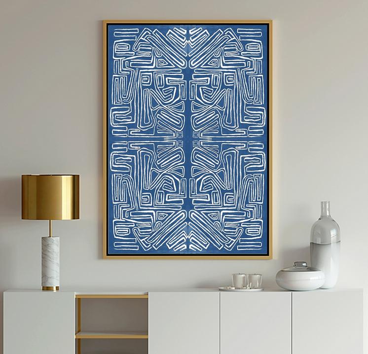 Abstract Art showing geometric shapes shades of blue and white against gray walls with a gold lamp