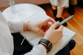 Therapy counselor with notebook