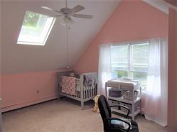 Pink walls in newly painted baby's room.