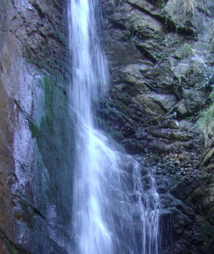 Small waterfall over rock face