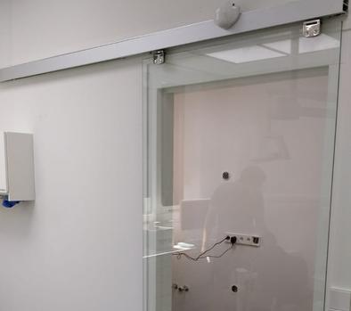 Magnetic sliding door opener