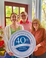 Nadine and Carl Glassman, Innkeeper Owners of the 1870 Wedgwood Inn Bed and Breakfast, New Hope, PA holding 35th Anniversary Plaque