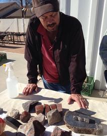 Mark Hileman with dinosaur bone rough