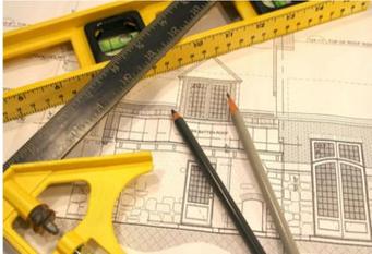 image of rulers and blueprints.