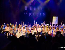 Fifty girls on stage at the House of Blues singing