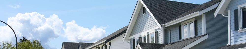 beautiful townhouses in gray, white, and tan