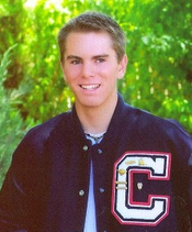 Grant Senior Picture, with letter jacket, smiling at camera