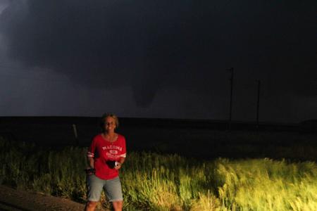 Tornado behind a smiling and happy tour guest