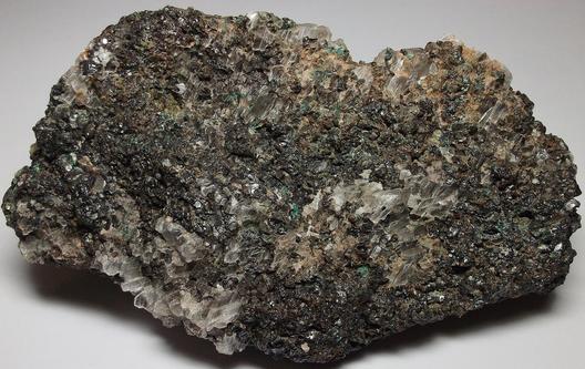 GYPSUM, MAGNETITE, fluorescent CALCITE, MALACHITE - Sterling Mine, Sterling Hill, Ogdensburg, Franklin Mining District, Sussex County, New Jersey, USA