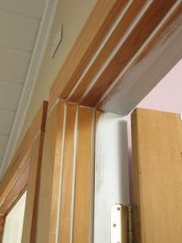 Caulked raw wood door casing before painting..