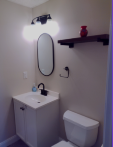 Norton bathroom after re-painting walls with Benjamin Moore "Edgecomb Gray"..