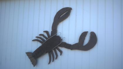 DIY Fence Fish made from recycled Trex. Make your own nauctcal or beach decore fence art. www.DIYeasycrafts.com