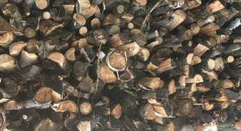 stacked split firewood, seasoned firewood, hamilton tree service