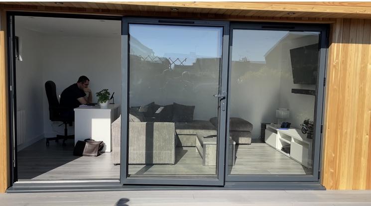 Large modern garden room with pool table and bar