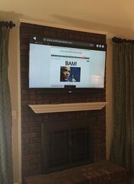flat screen tv mounted on unwired brick fireplace in charlotte nc, tv on fireplace, tv installers